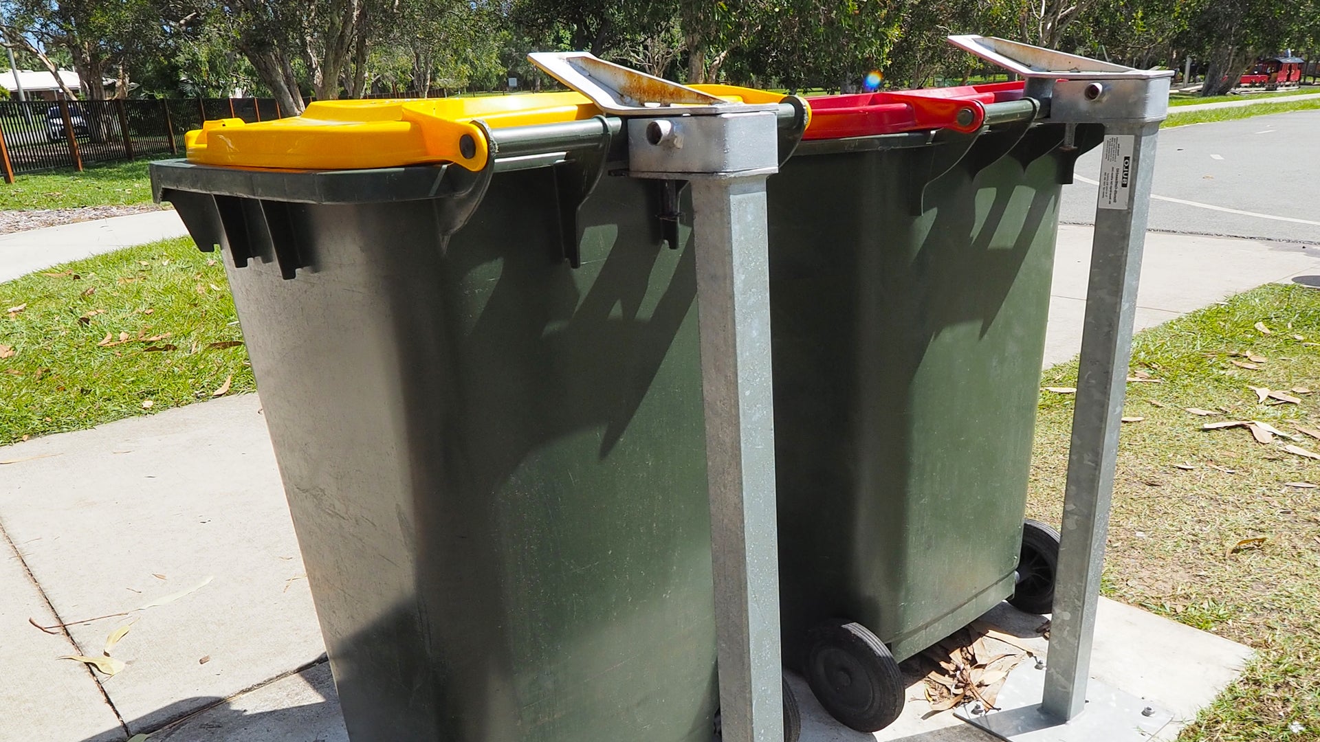 Typical wheelie bins mounted onto single security stands