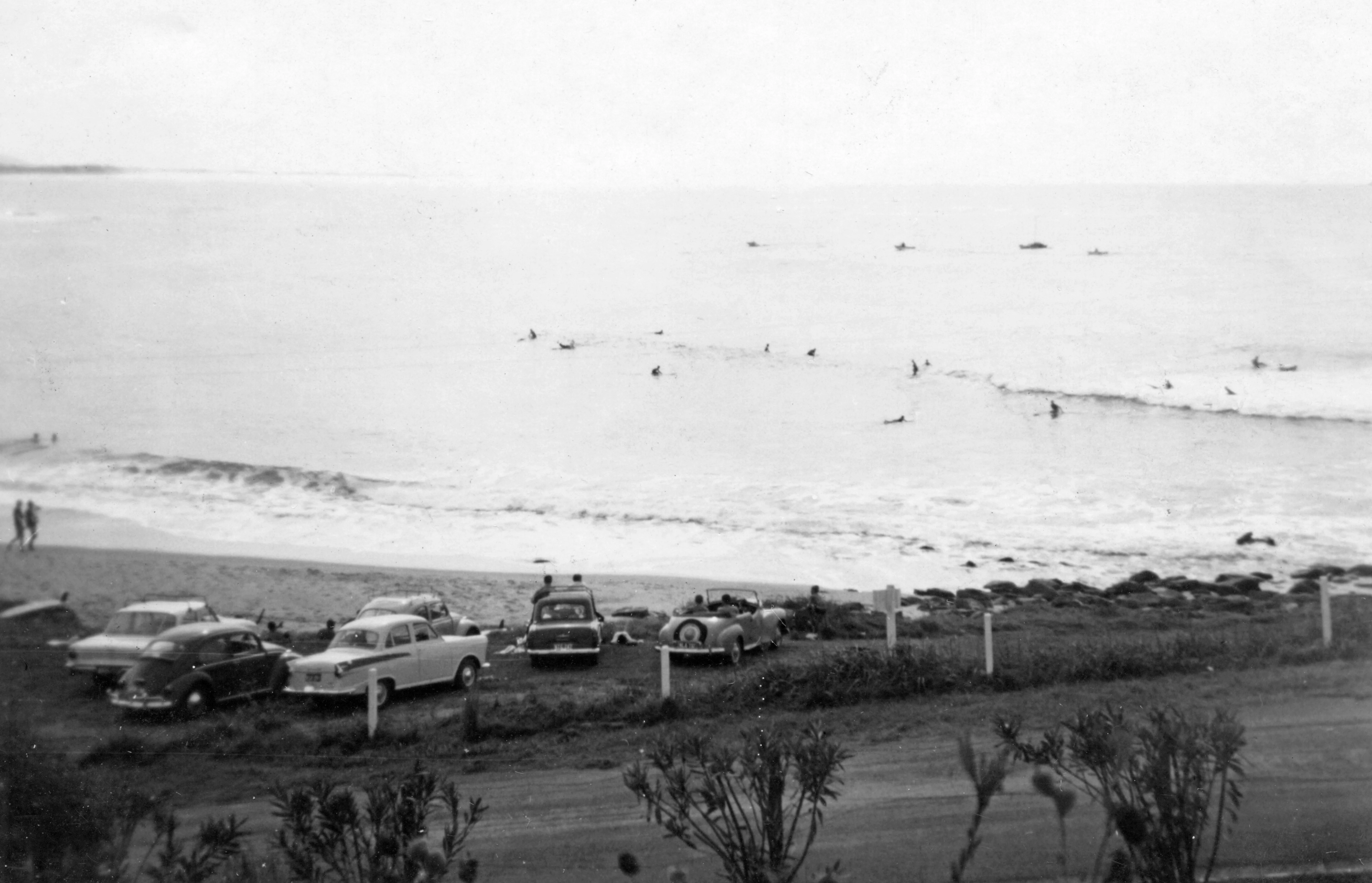 Board riders surfing at Moffat Beach, Caloundra, circa 1965 